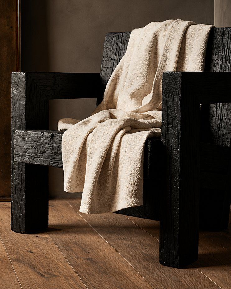 Private suite with a dark wood chair